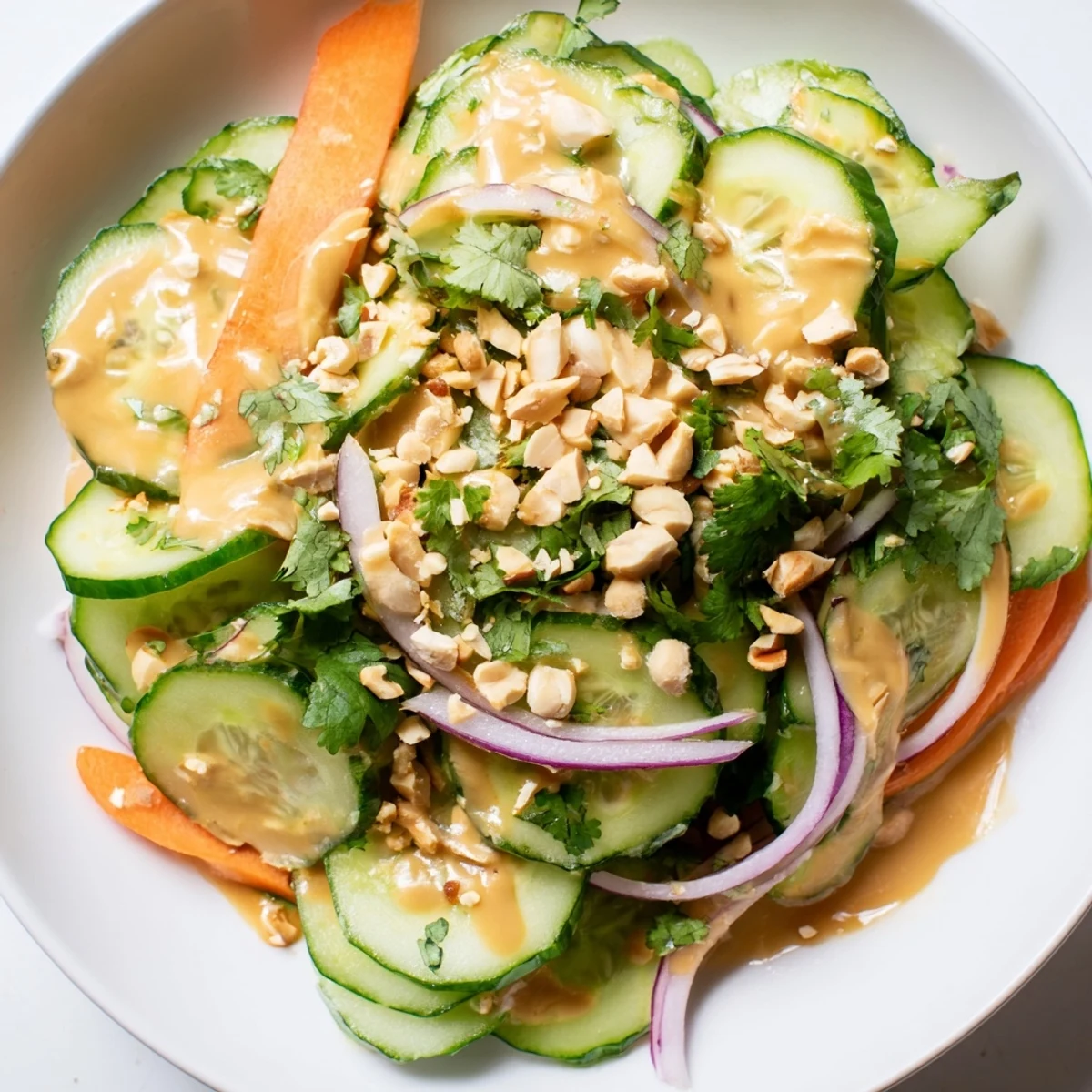 Vibrant Thai-Style Peanut Cucumber Salad, a refreshing mix of cool cucumbers and creamy peanut dressing.