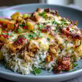 Pineapple Chicken and Rice Casserole with golden cheese topping and juicy pineapple chunks.  