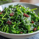 Bright lemon vinaigrette arugula salad with shaved Parmesan, toasted pine nuts, and a zesty citrus dressing for a fresh, vibrant dish.