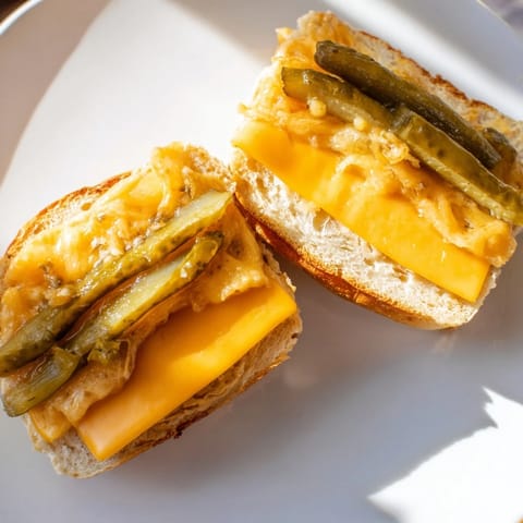 Crispy, melty cheese surrounds the pickles in this delicious Pickle Bread Sandwich, a perfect lunch idea.
