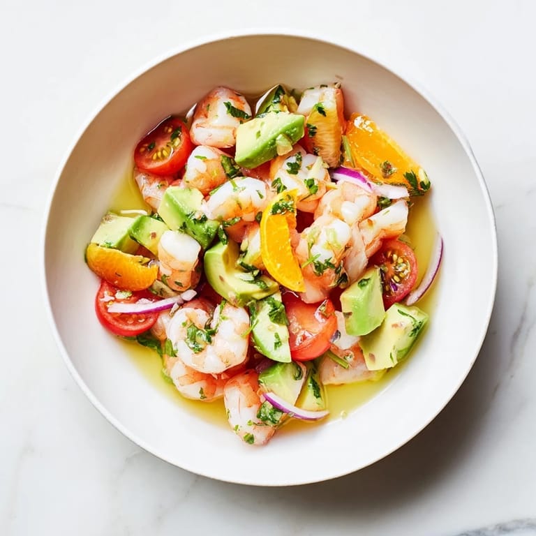 Zesty Light & Fresh Shrimp Ceviche with diced vegetables, avocado, and fresh cilantro, ready to serve.