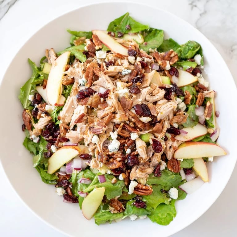Delicious Chicken and Apple Winter Salad, featuring a creamy dressing, looks refreshing and ready to eat.
