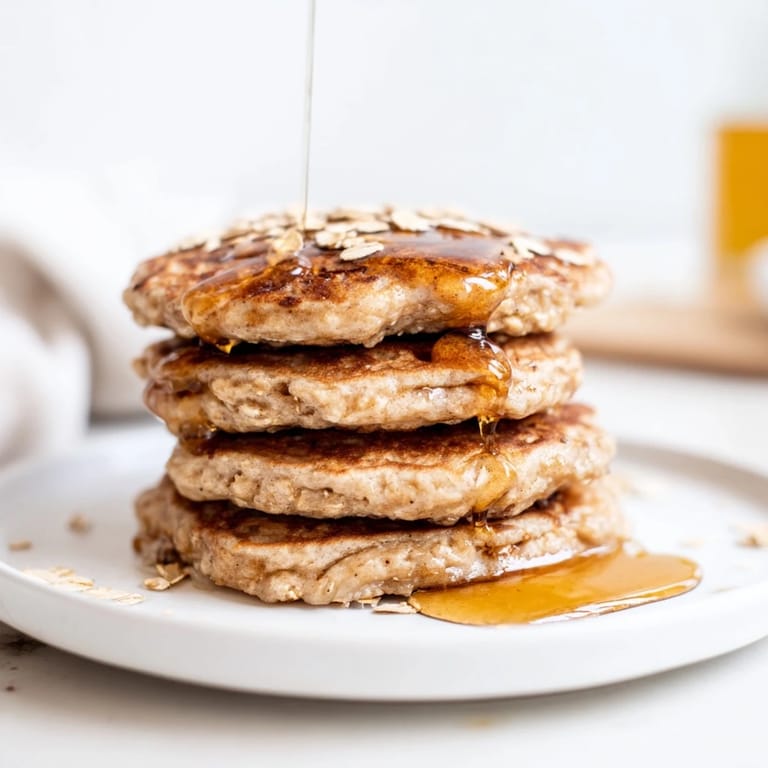 Fluffy banana oat pancakes, perfect for breakfast: a stack of wholesome, delicious goodness.