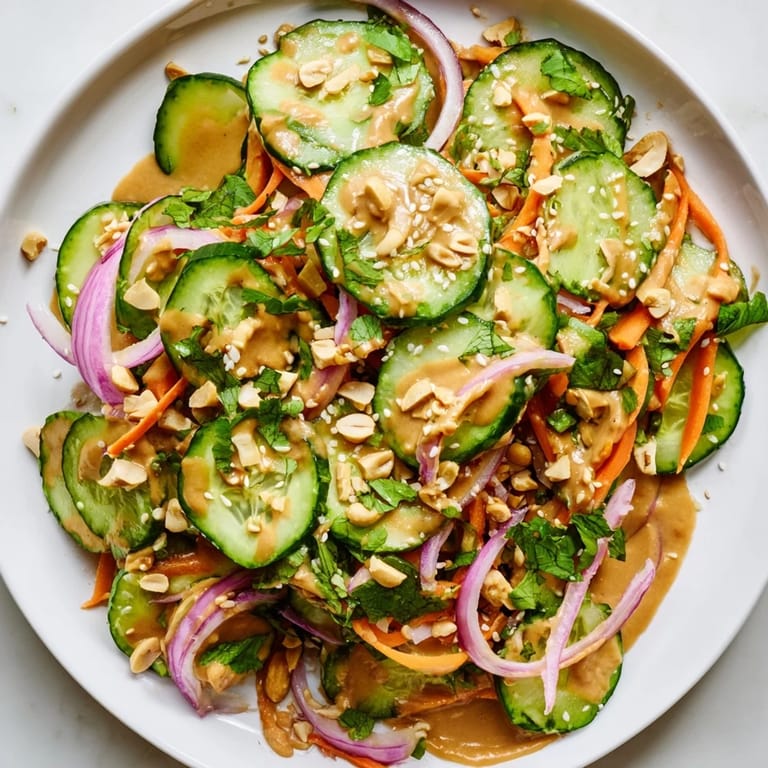 Close-up of freshly made Thai-Style Peanut Cucumber Salad, ready to be enjoyed as a side dish.