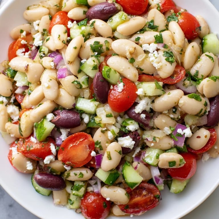 Hearty and delicious white bean salad, perfect as a light vegetarian lunch option.
