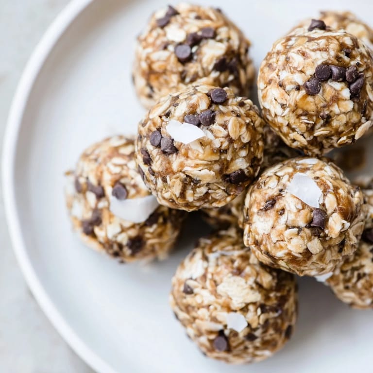 Close-up of moist Almond-Chia Energy Bites speckled with chocolate chips, perfect for a quick energy boost.